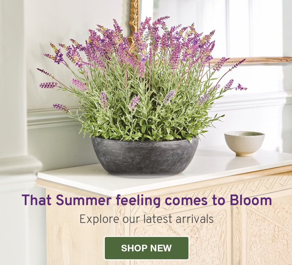 Faux lavender arrangement in black vase