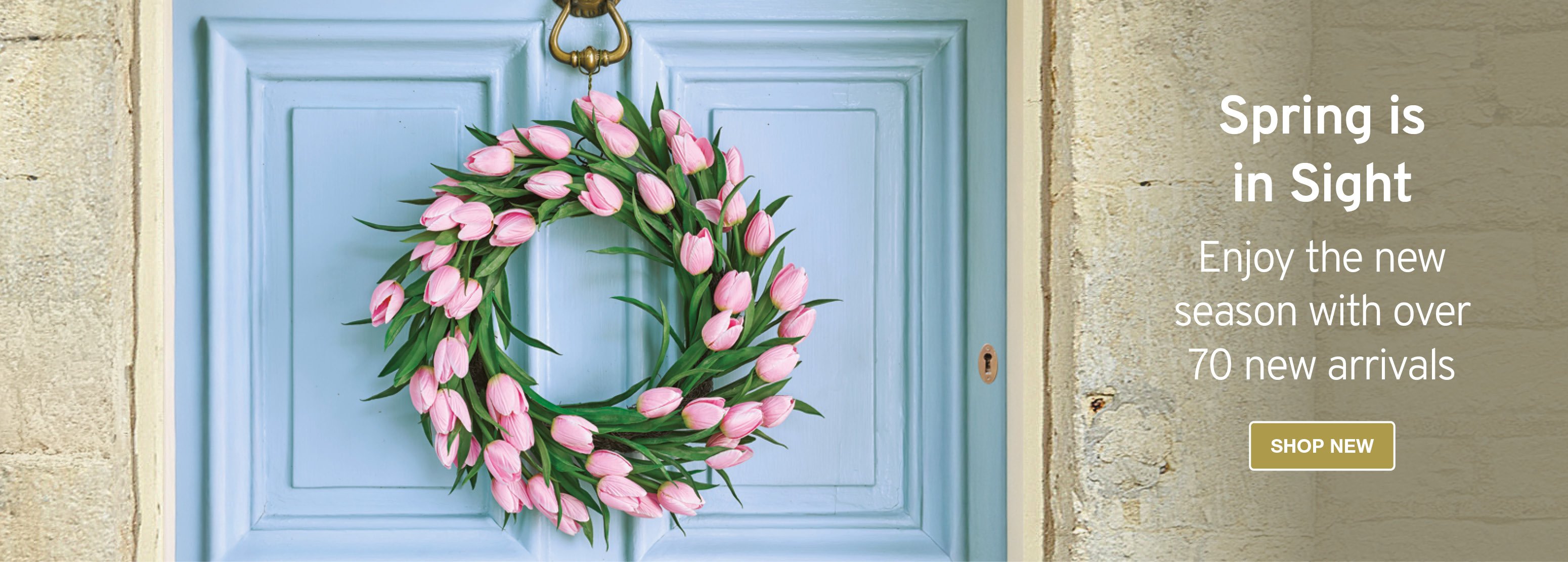 Image of faux pink tulip wreath on blue door