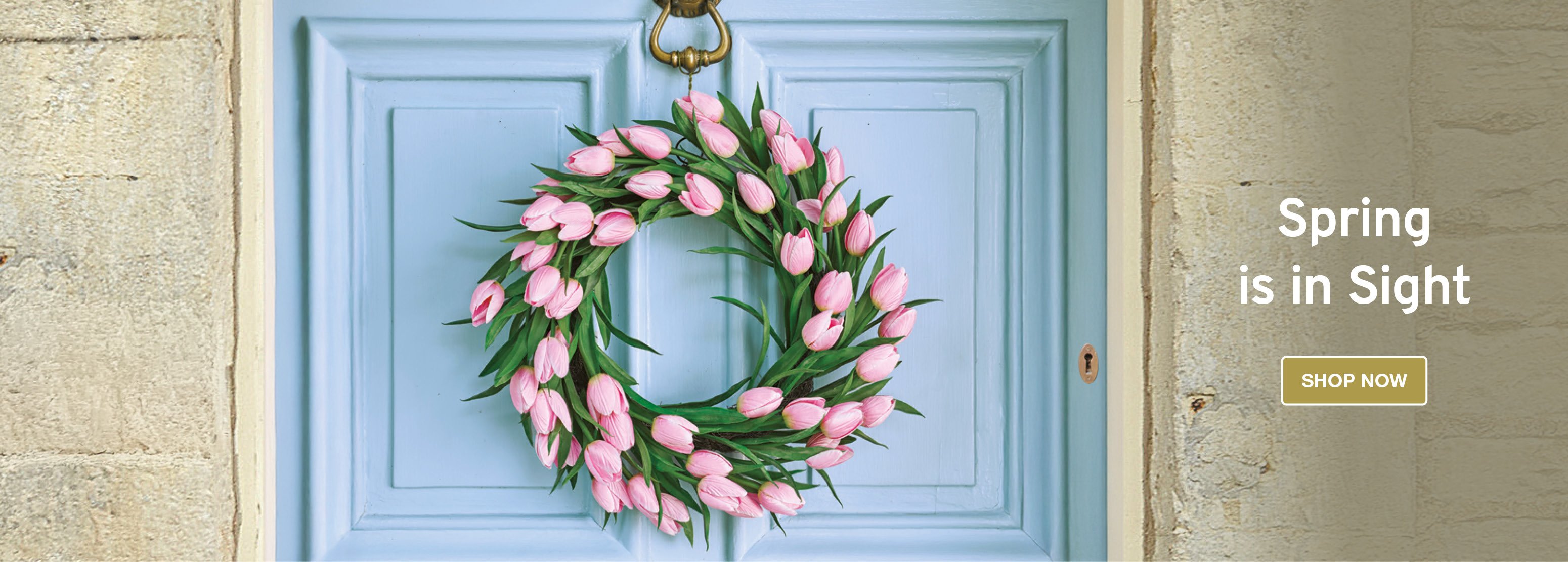 Image of faux pink tulip wreath on blue door