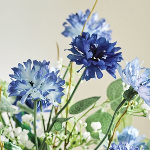 Close up image of faux blue cornflowers
