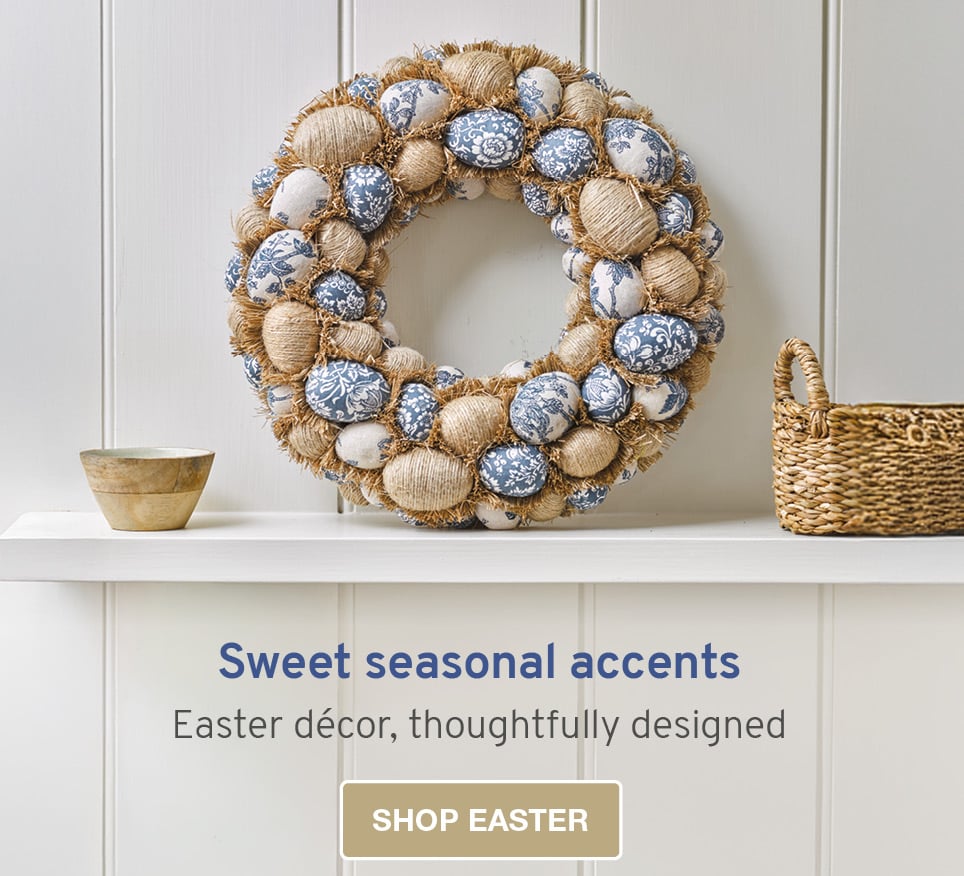 Image of a faux wreath featuring rattan and blue easter eggs