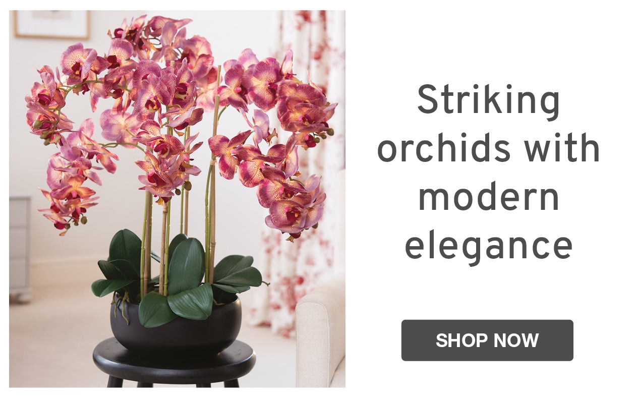Faux pink orchid in black ceramic pot