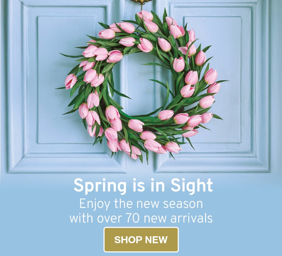 Image of faux pink tulip wreath on blue door