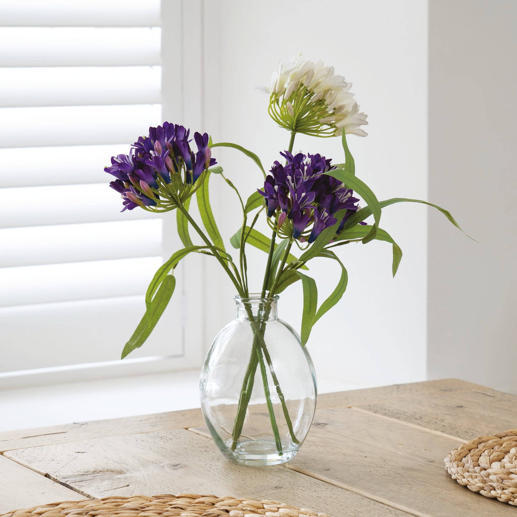 3 pink faux cyclamens in black planters