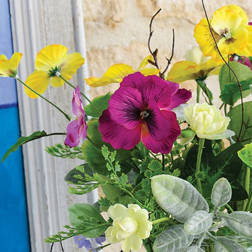 Close up image of mixed faux flowers 