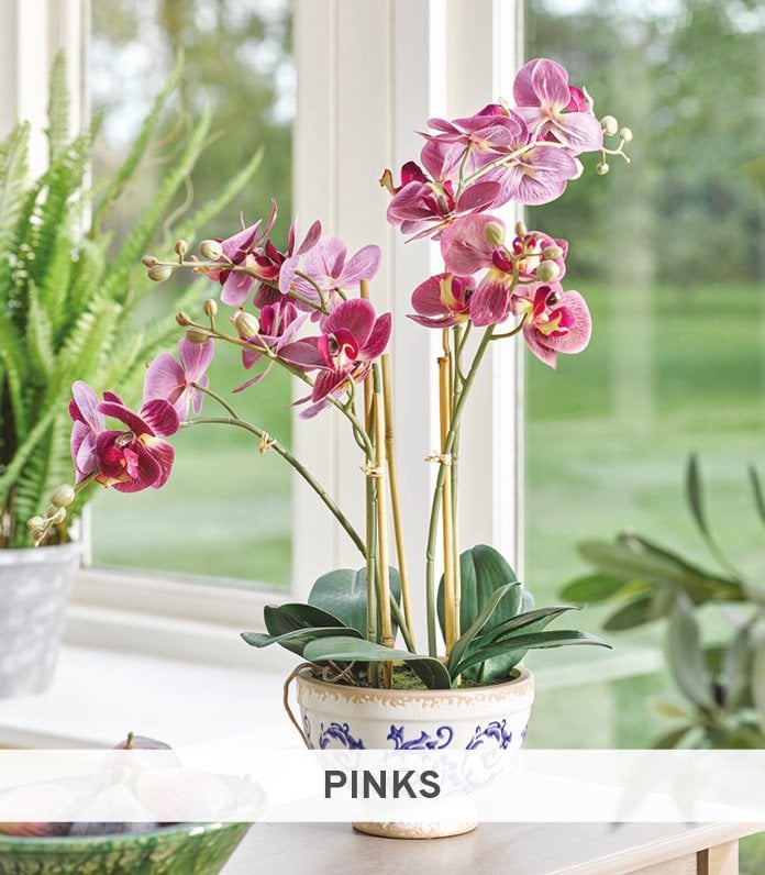 Faux pink orchid in china pot