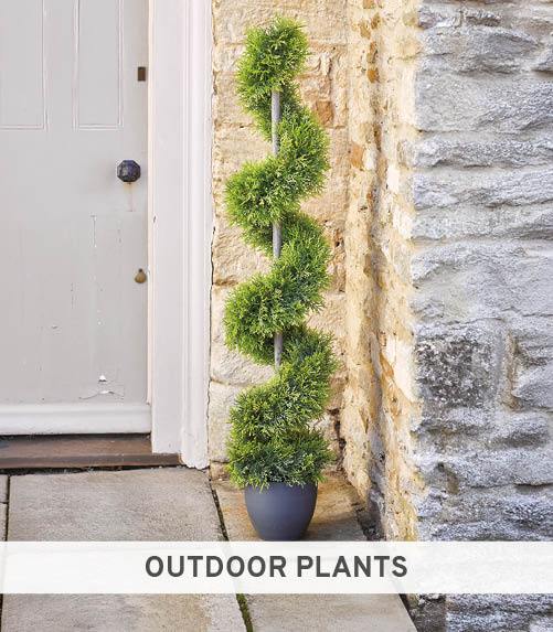 Faux green topiary swirl tree in black planter