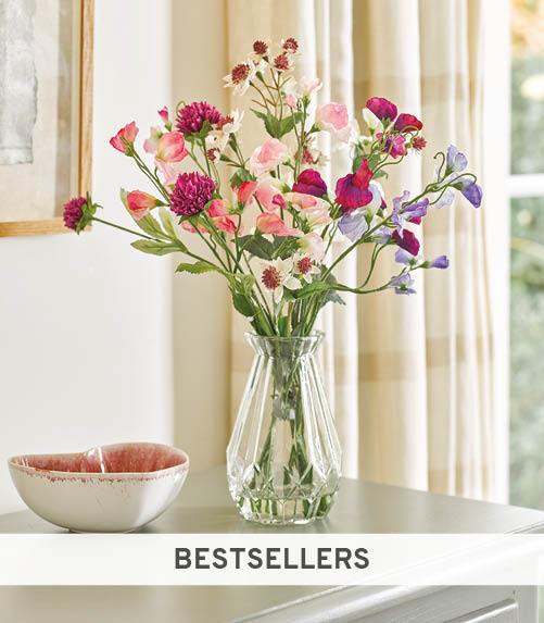 Faux sweetpeas in glass vase