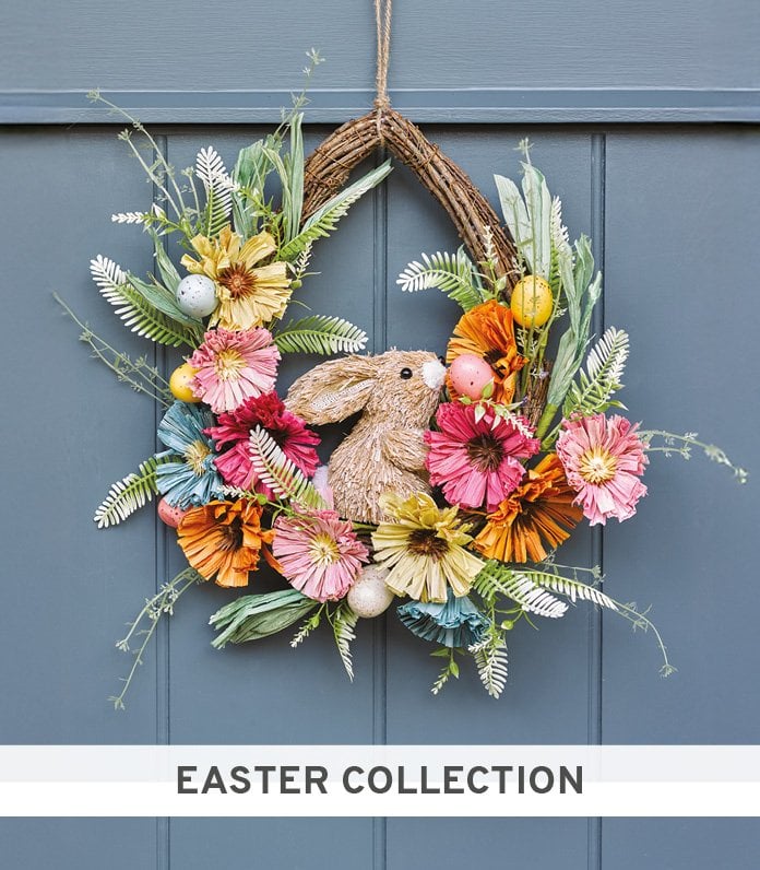 Faux wreath made up of raffia bunny and flowers